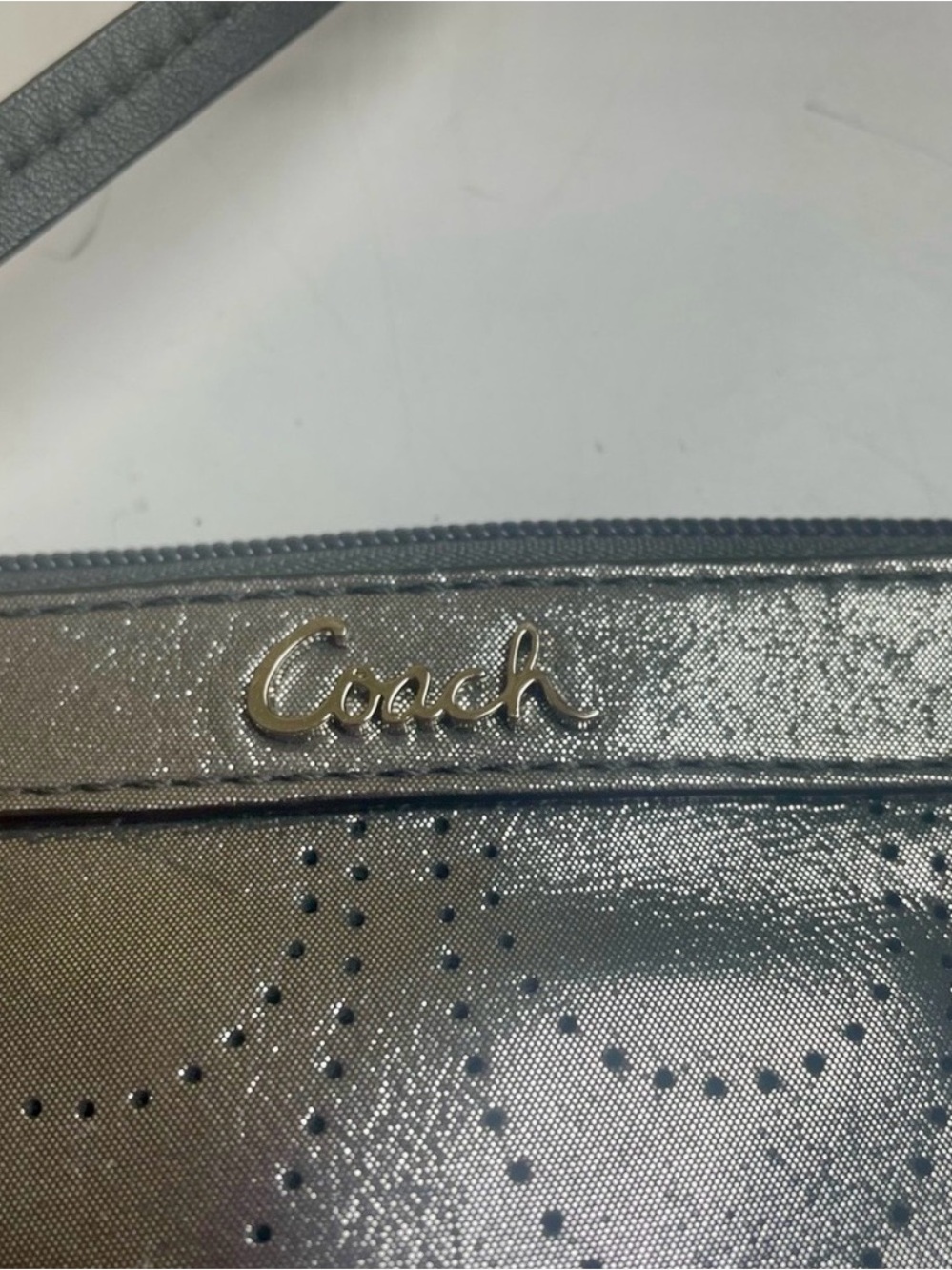 Coach Metallic Silver Wristlet with Perforated Dot Motif